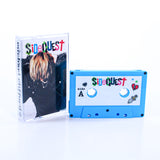 A blue cassette tape labeled SiderJest with colorful letters and doodles, next to a matching case featuring the same text and a photo of a blonde-haired person—ideal for Michael Clifford fans or quirky gaming collectors.