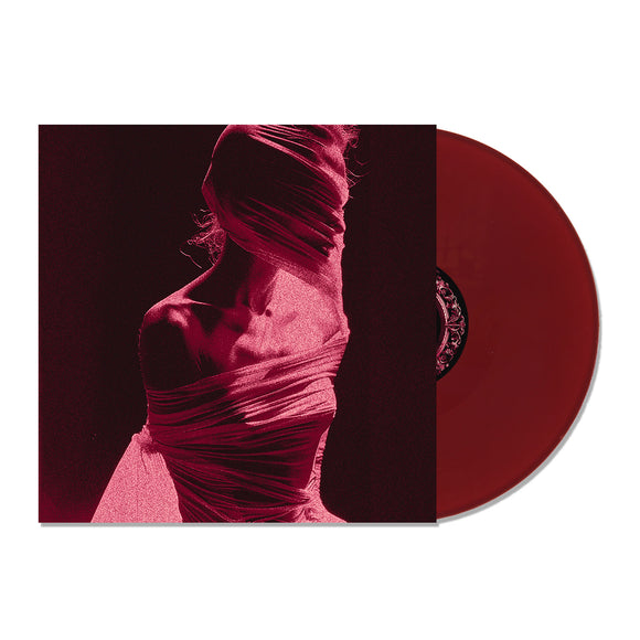 A maroon limited edition Arankai vinyl record slides from its album cover, which displays a stylized person draped in sheer fabric, their face and upper body obscured amid a striking red and black color scheme.