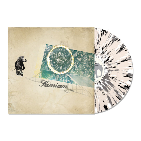 A limited edition splatter LP from Samiam partially slides out of its sleeve, which features an illustration of an elephant on a skateboard and abstract shapes, with 