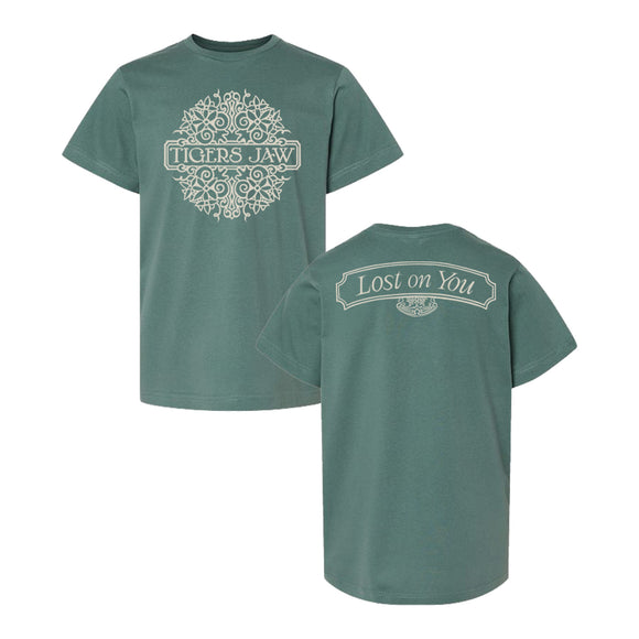 Tigers Jaw green LAT Youth Tee with ornate white designs: “Tigers Jaw” in a decorative circle on the front, and a banner reading “Lost on You” with matching graphic on the back. Exclusive Tigers Jaw design.