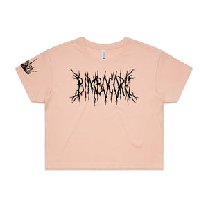 pink cropped womens tee on white background. full chest print in black that says bimbocore with small print on bottom right sleeve of crown in black.