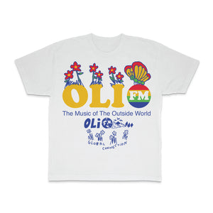White t-shirt on a white background. Chest print shows OLI in yellow text with FM in a multi-color circle. Flowers and Butterflies come out of the lettering. The Music of the Outside World text below in blue above blue text Global Connection