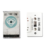 White Cassette on a white background. All Time Low "Future Hearts". Blue circle that contains a heart and eyeball. Shows both cassette case and cassette