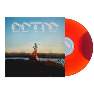Foxing "Draw Down The Moon" Vinyl Album cover. DDTM letters above a man walking with a sword on a plain with mountains in the background. Vinyl variant color is called "Phase"